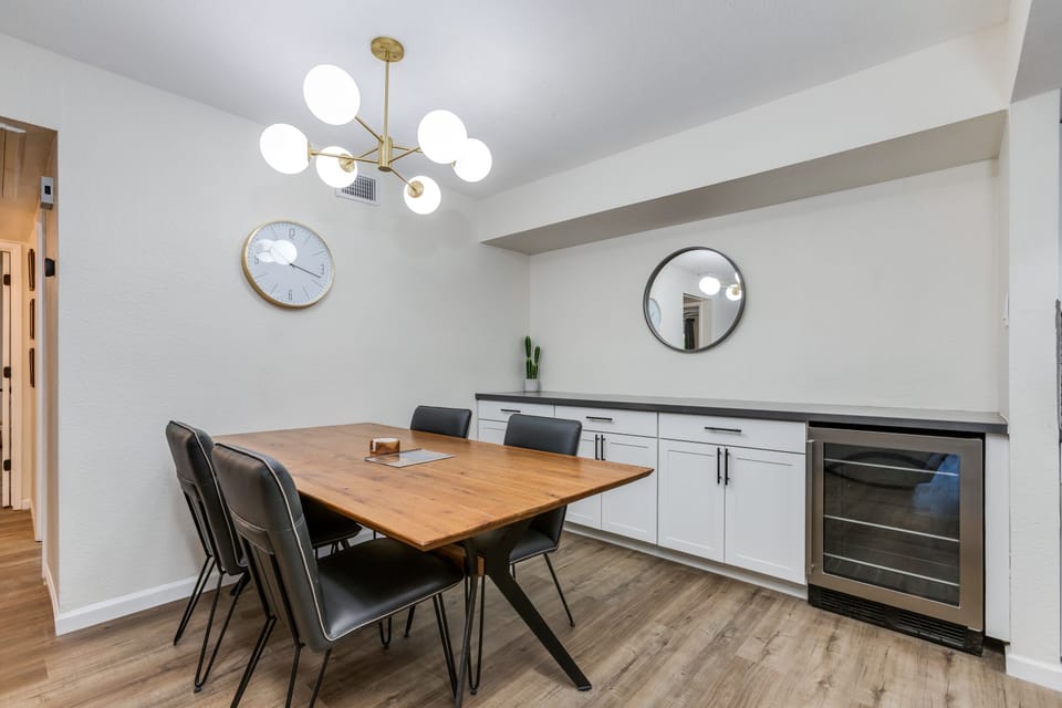 Beverage Fridge and extra cabinets and couter space in dining area
