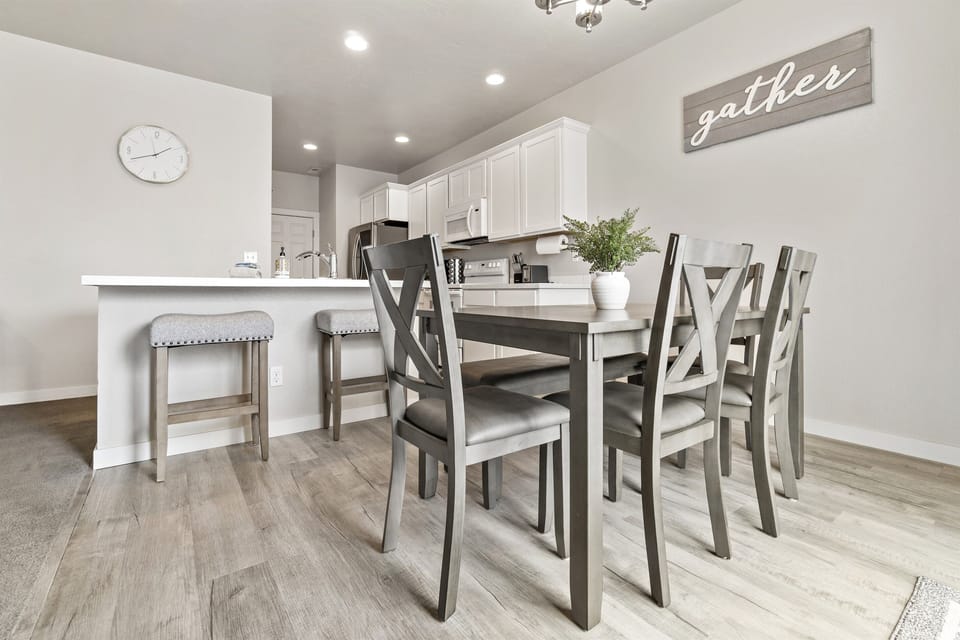 Plenty of seating with the dining room table and two counter top spots!