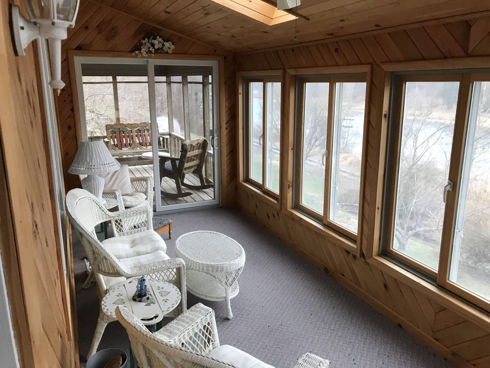 Beautiful sun room to enjoy the river and mountain views, and wildlife.