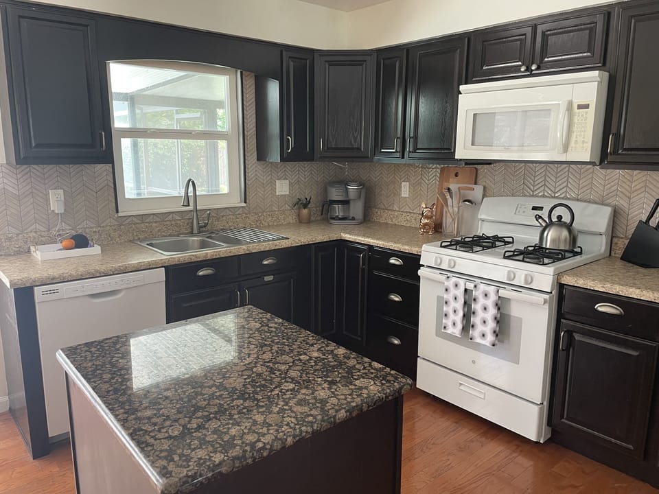 Updated, fully stocked kitchen. 