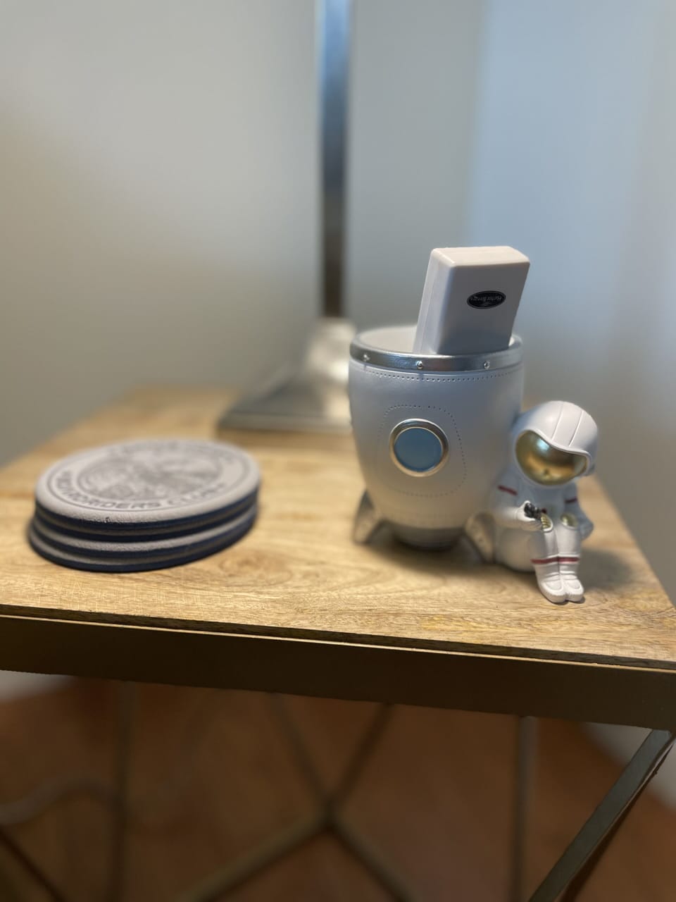 Cute space coasters & astronaut remote holder are just a few of our fun accents.