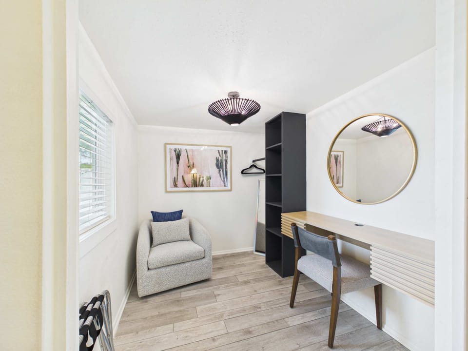 guest casita room with king sized bed, smart tv and dedicated workspace 