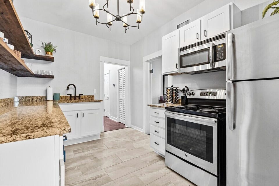 Kitchen: Modern appliances and sleek counters invite culinary adventures in this stylish space!