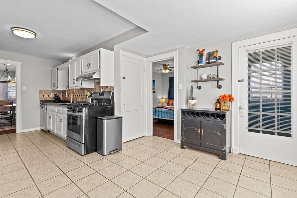 Large, functional kitchen with plenty of counter space, ample cabinetry, and modern updates—ideal for preparing family meals or hosting small gatherings.