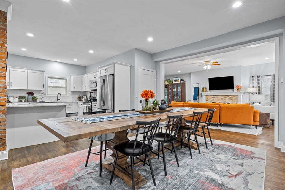 Open dining area overlooking the kitchen and living room, ideal for families and groups who love to entertain in a stylish setting.