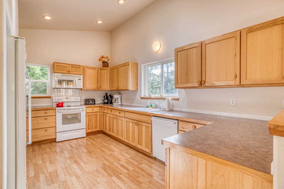 Kitchen with appliances and amenities