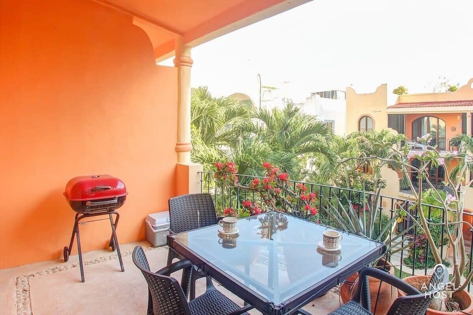 Enjoy a meal in this cozy outdoor dining area.