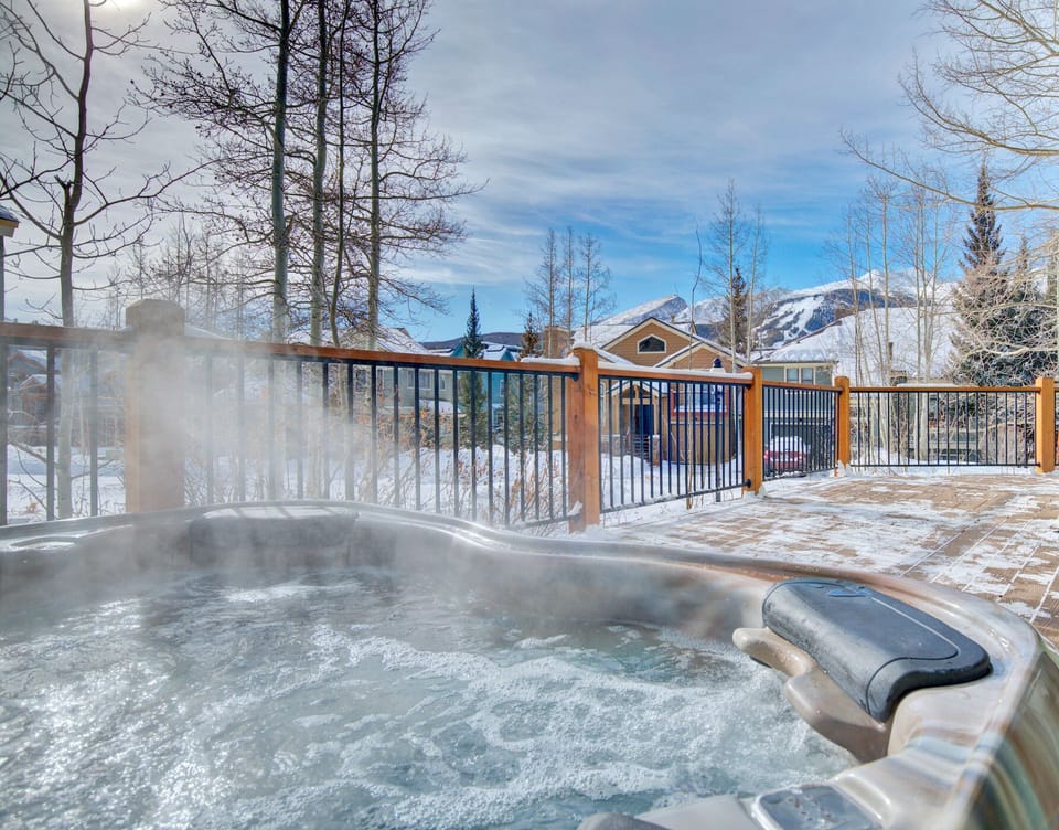 Relax after a long day on the slopes in the private hot tub, conveniently located  on the wrap-around deck