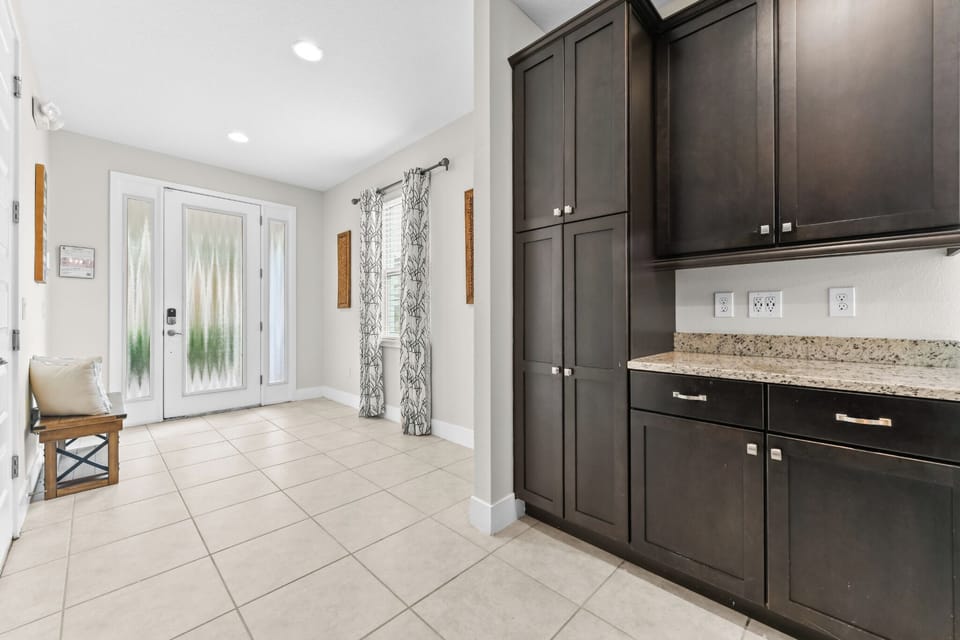 FOYER:  Entryway adjacent to Kitchen and Game Room
