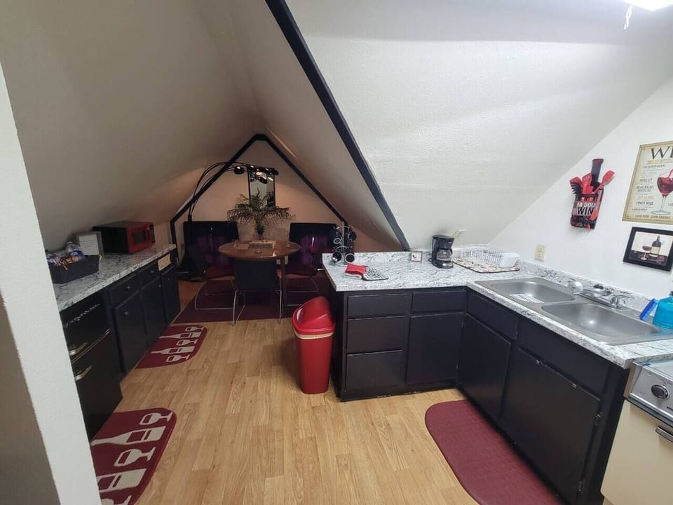 Kitchenette with everything you need to cook and serve meals.