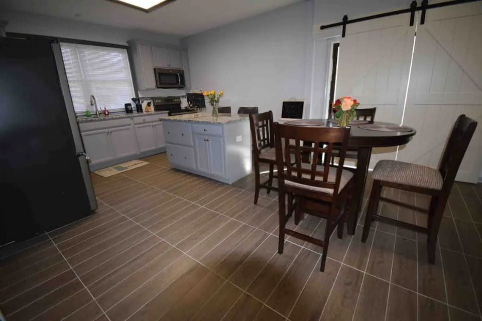 Open concept kitchen with island and breakfast area 