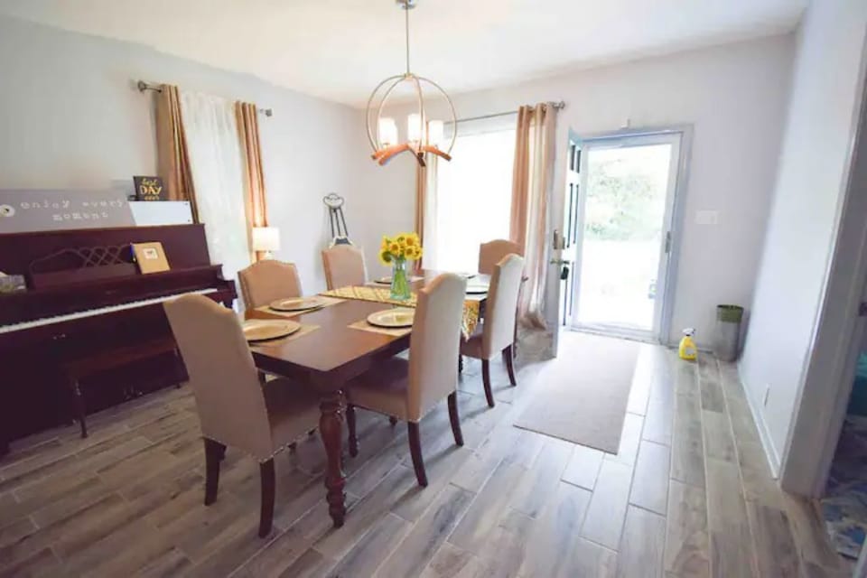 Formal dining room with a piano 