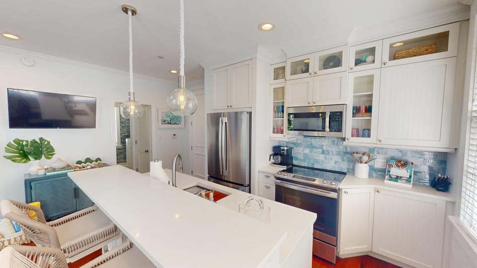 Kitchen area with bar top seating