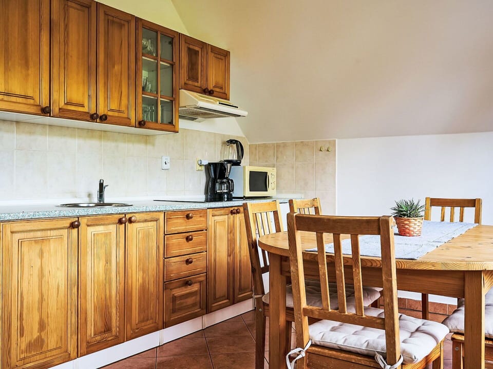 Cabinetry, Furniture, Property, Countertop, Wood, Drawer, Chair, Interior Design, Kitchen, Floor
