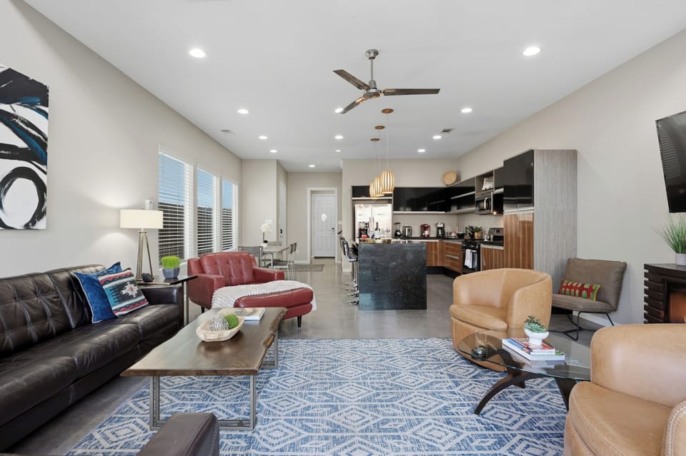 This open-concept space seamlessly connects the kitchen, dining, and living areas.