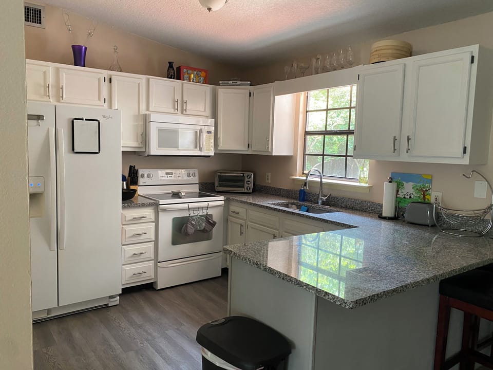 Kitchen has a lot of stuff you need for cooking 