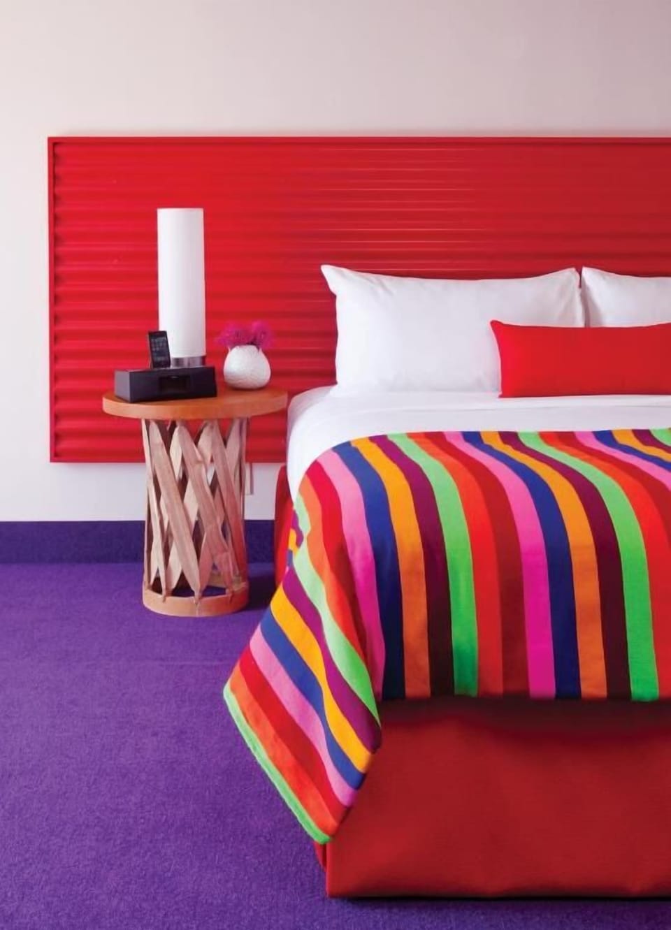 Stretch out under a vibrant throw for a cozy night’s sleep.