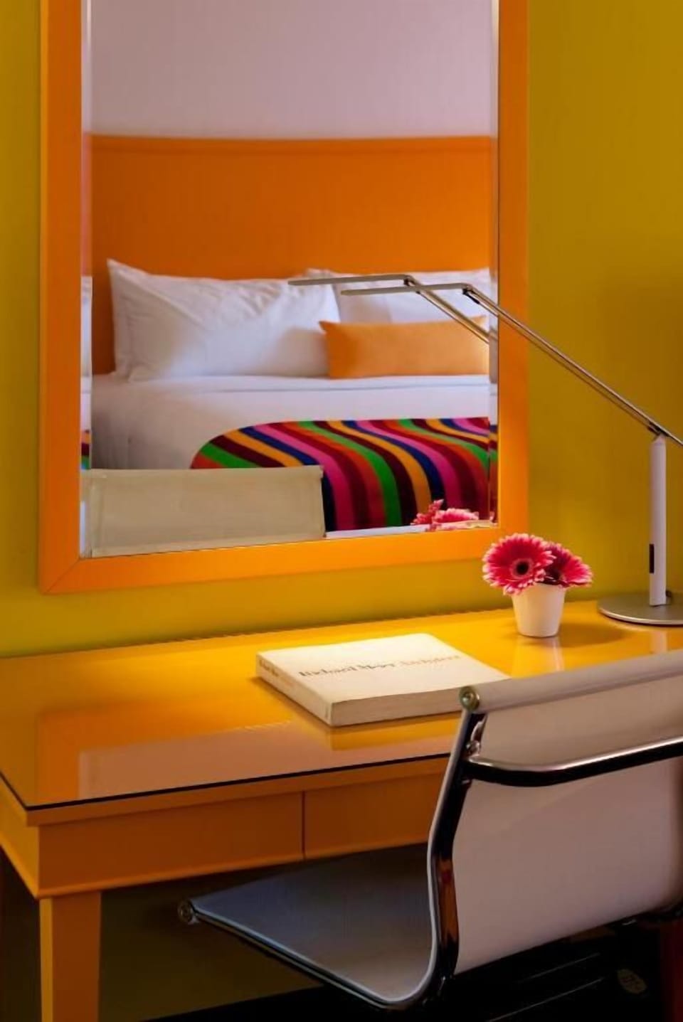 Settle in to focus at the sunny desk with mirror view.