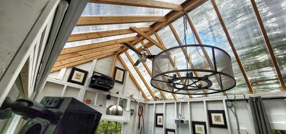 Greenhouse roof with chandelier and ceiling fan.  Lights are all on a dimmer so you can adjust the lighting just the way you like it.