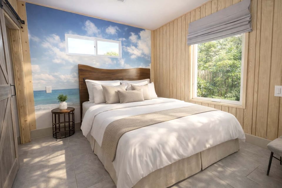 Cozy Bedroom with Large Window, Natural Light, and Peaceful Atmosphere