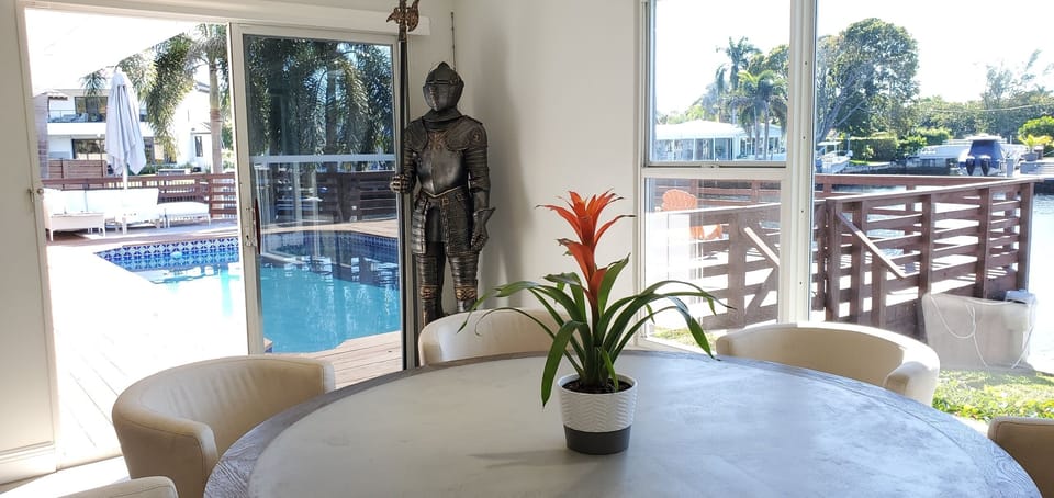 Dining area opens up to patio deck and pool.