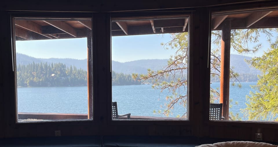 Lake view to wake up to in the master bedroom downstairs in main cabin.
