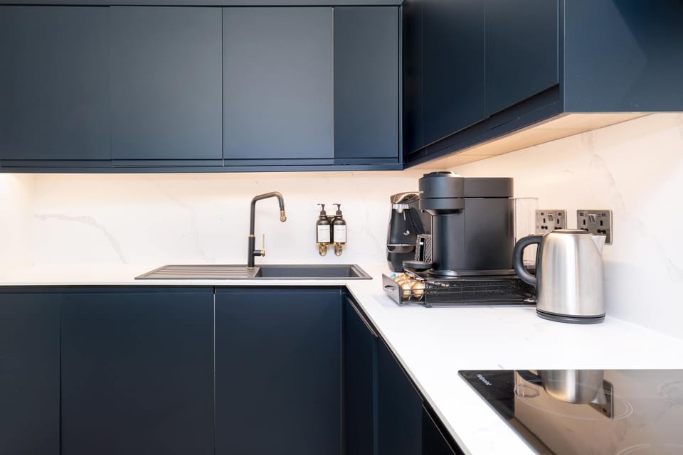 Full Kitchen | Indulge in a fully-equipped kitchen, perfect for any length of stay. Enjoy modern conveniences like a washer, dryer, dishwasher, espresso machine, and a fresh water dispenser.
