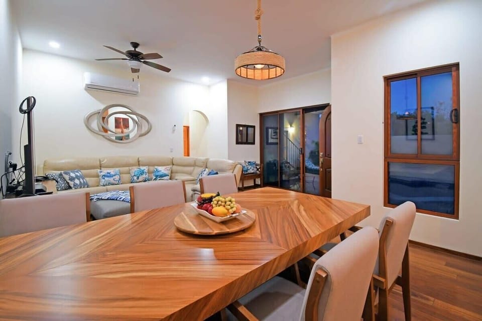 A large lovely wood dining table to comfortably seat 6 for sit-down meals