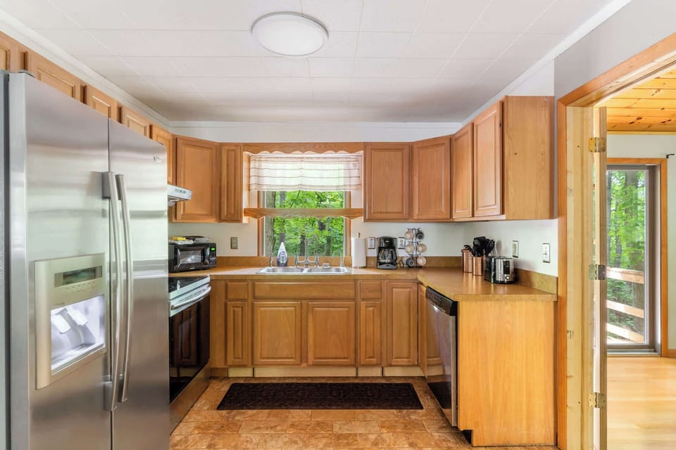 Fully-stocked kitchen with a stove/oven, and microwave