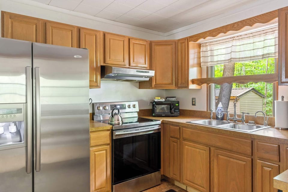 Fully-stocked kitchen with a stove/oven, and microwave