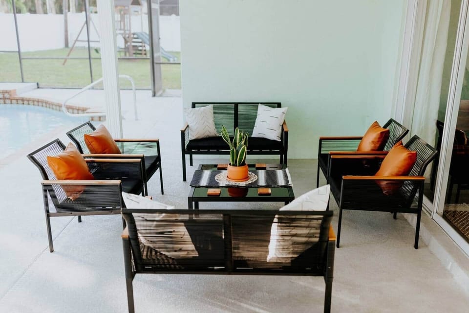 Relax in the shaded veranda. Perfect for watching the kids play in the pool, surrounded by tropical landscaping, with a killer sunset in the evening!! (The sun sets over the pool, flooding the lanai with a golden glow. Nothing quite like it!!) 