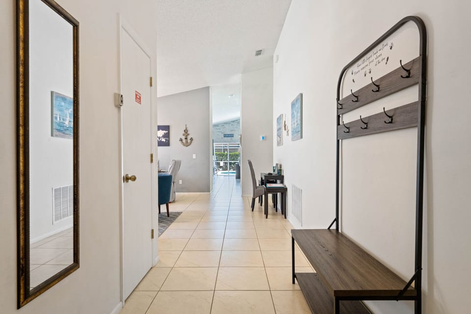 The entryway has a spacious area to leave your bags, coats & shoes.