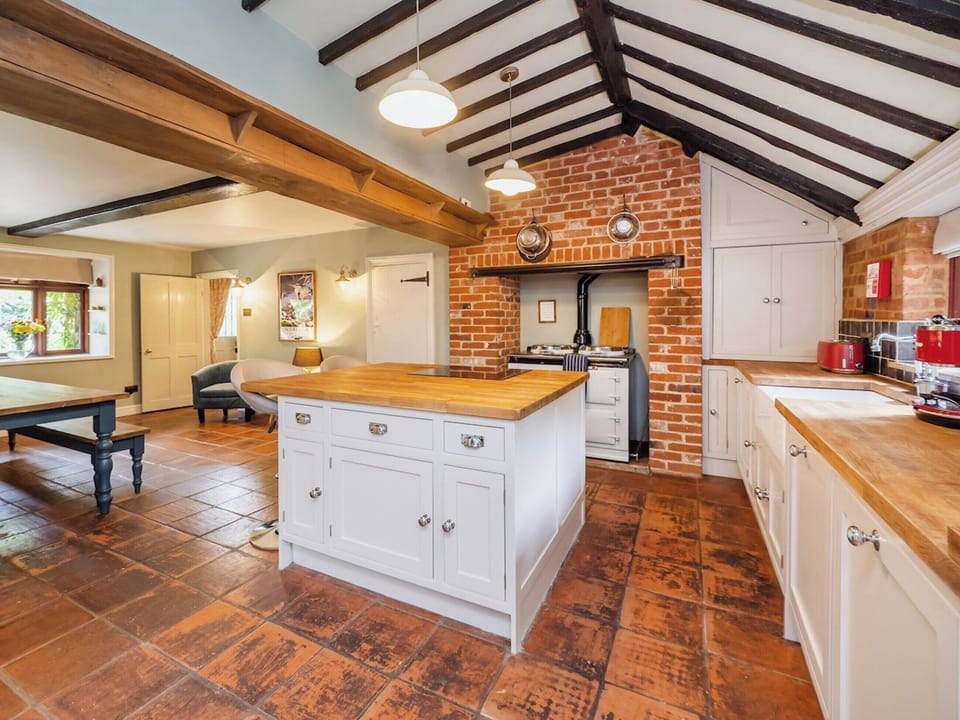 Kitchen with gas aga, Slide and Hide oven and induction hob | The Norfolk Broads CottageFarthings, Wroxham