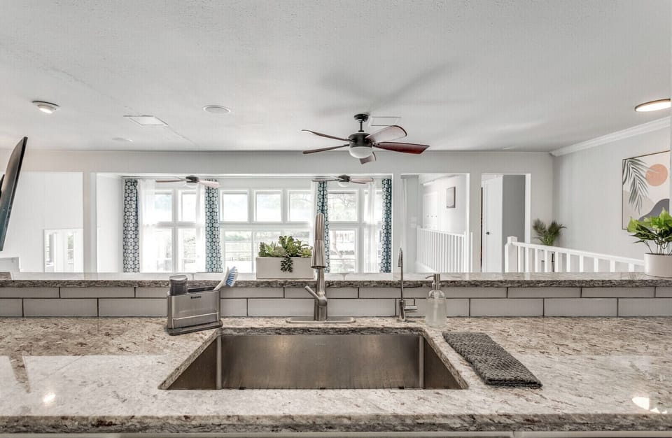 The kitchen overlooks the lake and living room below.