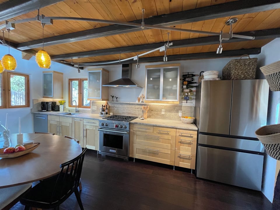 Contemporary galley kitchen. New chef grade appliances and fully stocked.