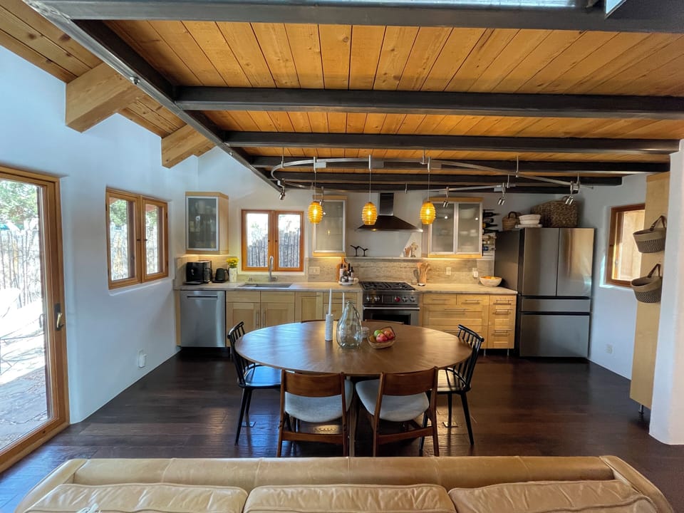 Open concept kitchen, living, dining and extra loft living space upstairs.