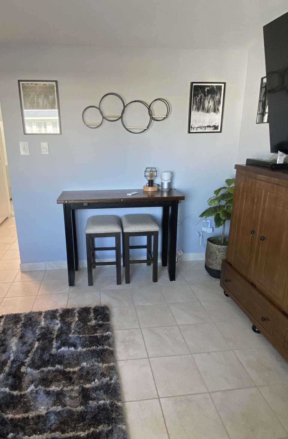 Living room with dining table that extends out. 