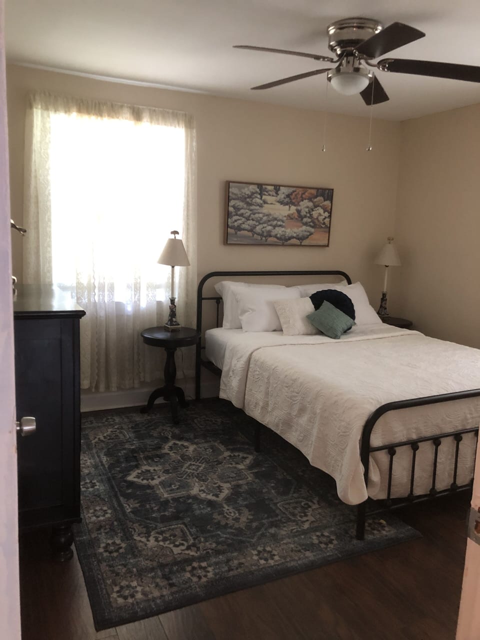 Main floor bedroom 2. Queen bed with 4 pillows.