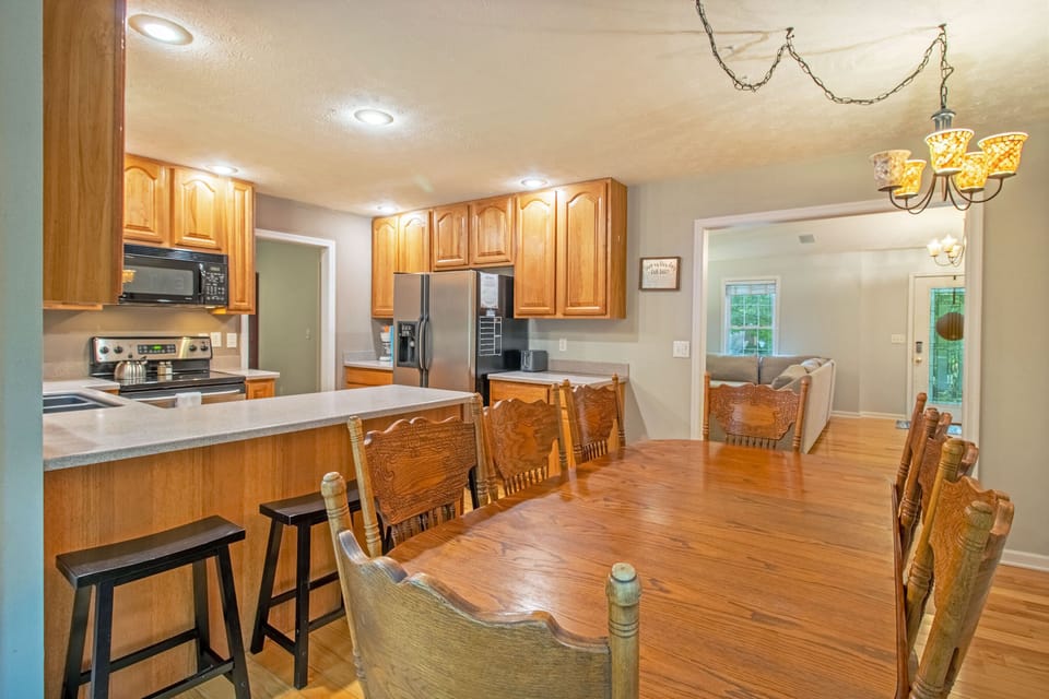 Dining and kitchen area with extra seating available at the bar