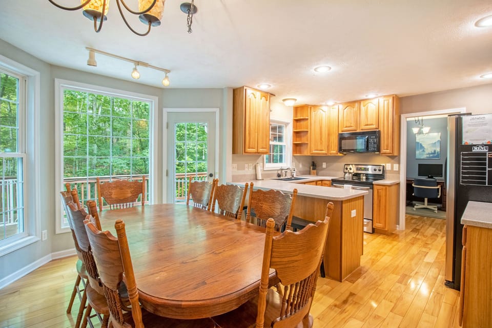 Dining and kitchen area with extra seating available at the bar