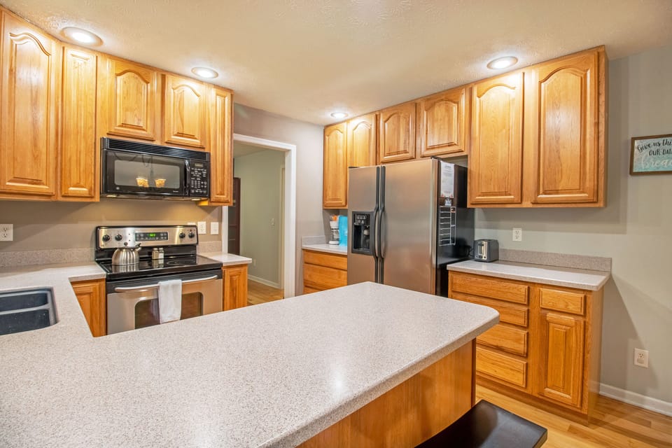 Dining and kitchen area with extra seating available at the bar