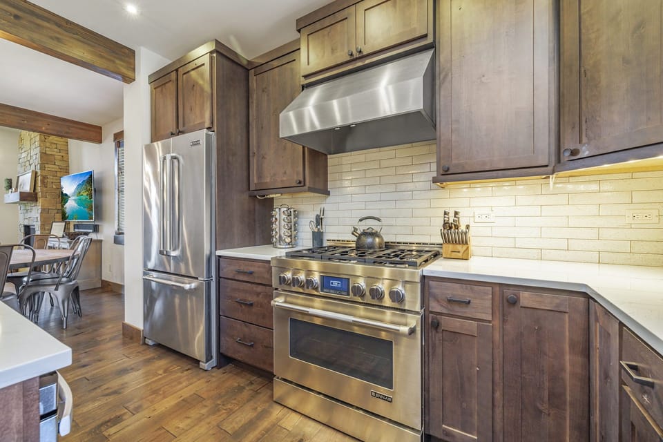 Chef’s Kitchen W/ Premium Stainless Appliances + Oversized Quartz Island