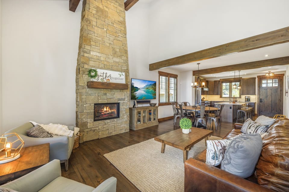Vaulted Living Room W/ Soaring Wood Ceilings + Grand Stone Gas Fireplace