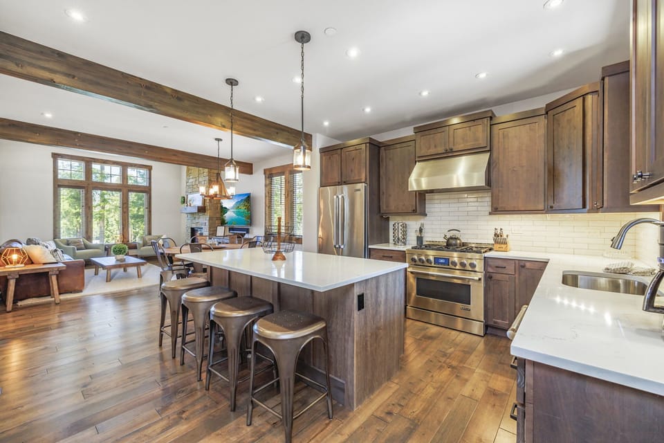 Open-Concept Living + Dining W/ Double-Height Ceilings + Rustic Beam Detail