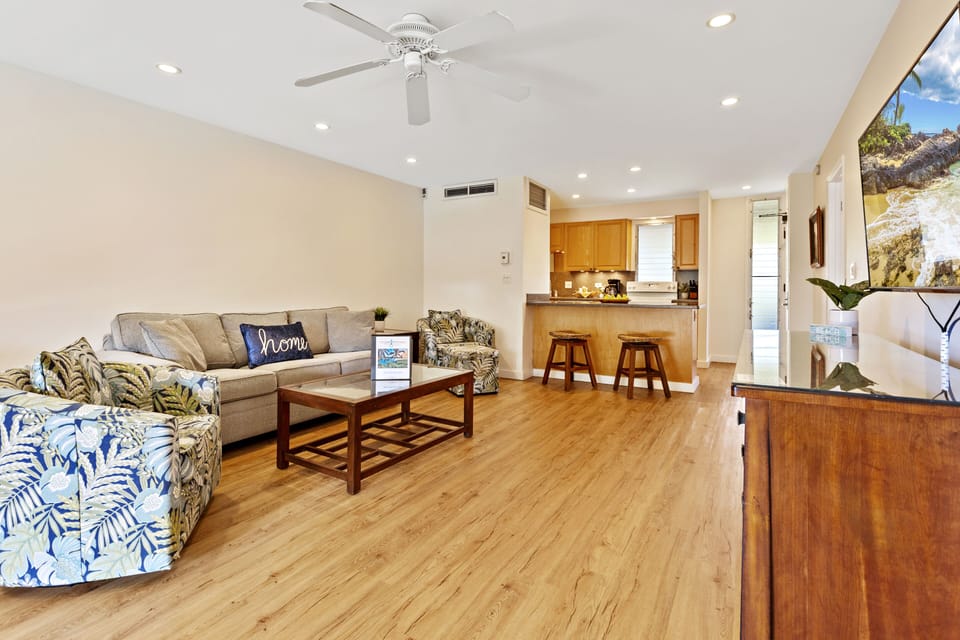 Living Room – Wide Angle - Open living space with comfortable seating, ideal for family gatherings or relaxing after a beach day.
