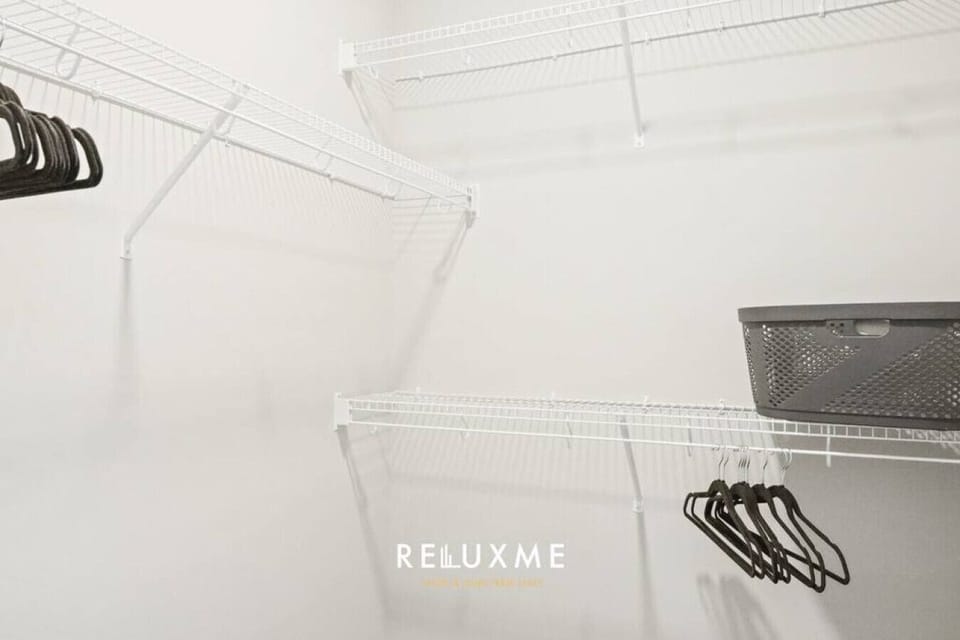 Spacious closet with hangers and shelves