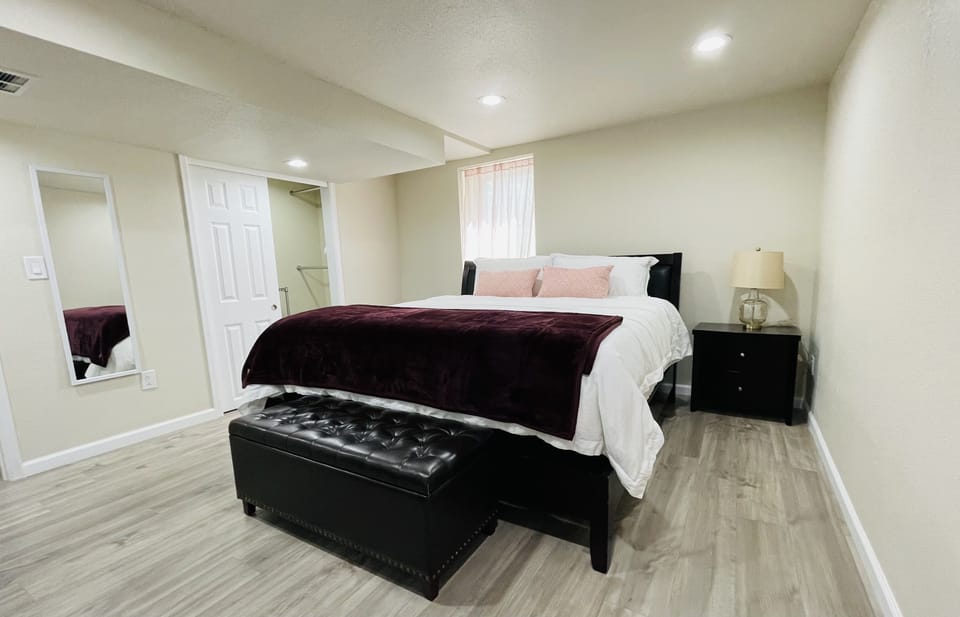 master bedroom with walk-in closet & full length mirror