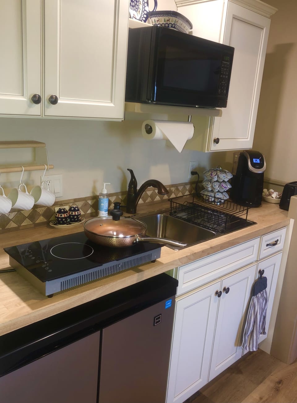Kitchenette with induction burner, air fryer and an electric skillet.
