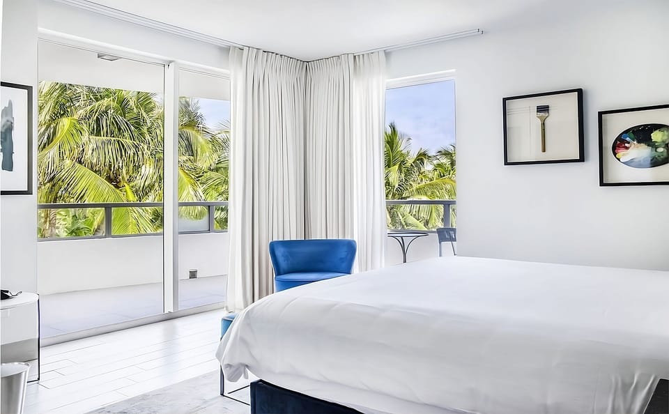 Wake up to sunlit comfort steps from your private balcony.