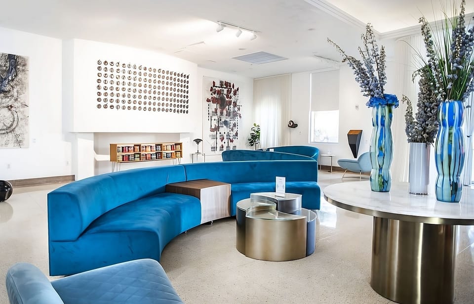 Gather for pre-dinner chats in an airy, art-filled lobby.